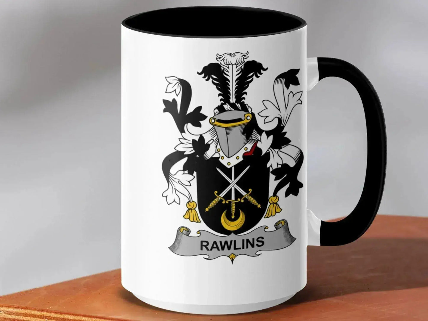 15oz black and white mug featuring Rawlins family crest with crossed swords and heraldic design