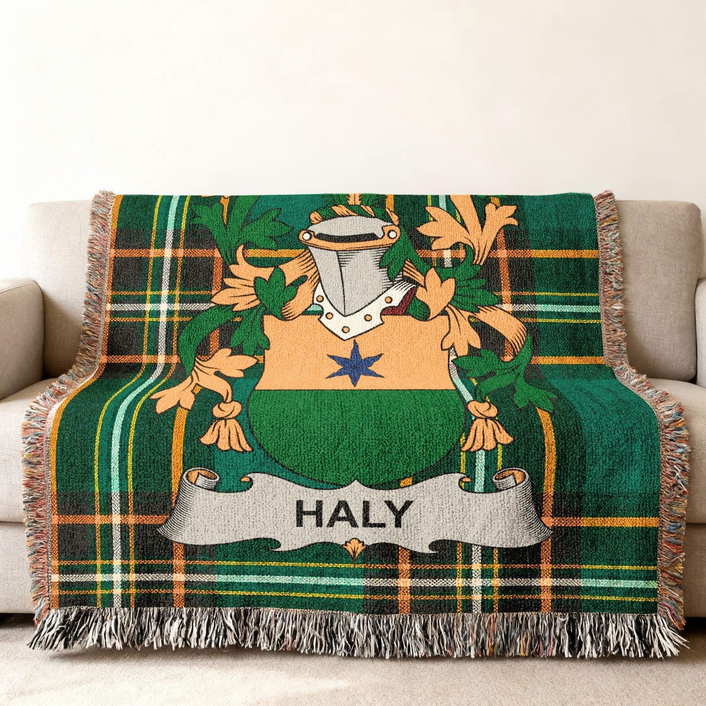 Green tartan blanket with Haly family crest displayed in the center.