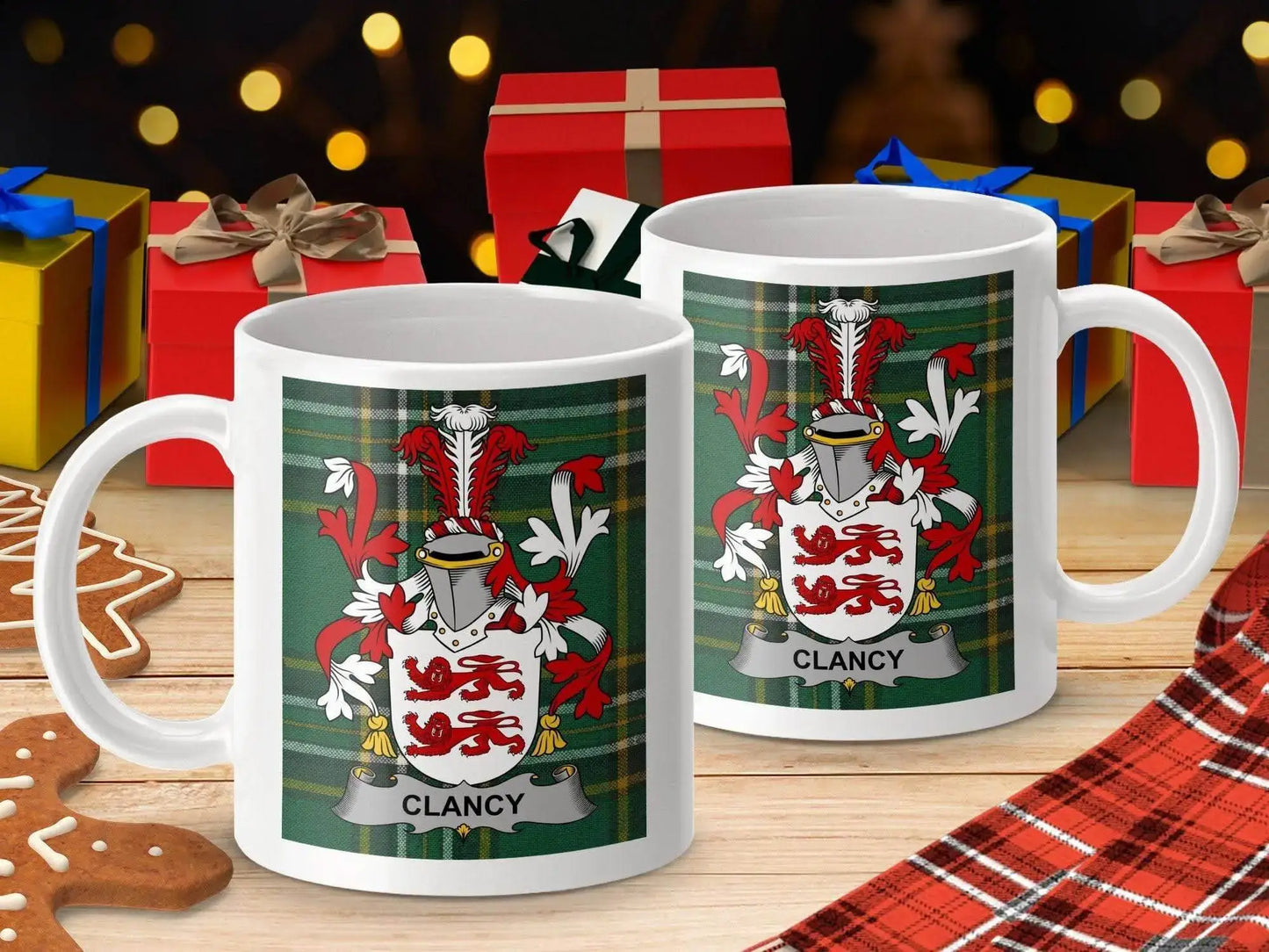 White mugs with Clancy family crest on green tartan, holiday gifts and gingerbread on wooden table