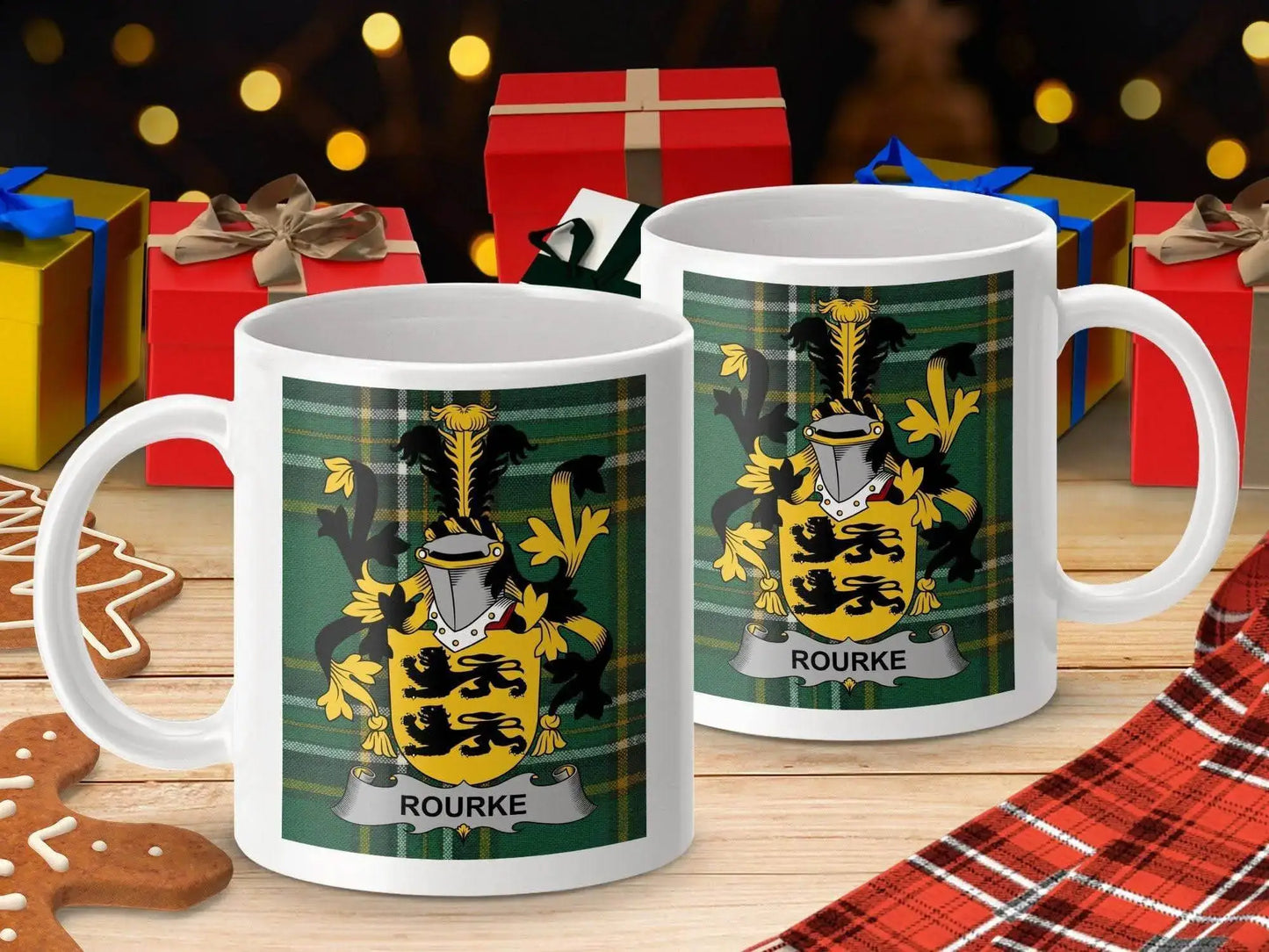 Rourke family crest mugs on wooden table with Christmas gifts, gingerbread cookies, and plaid cloth