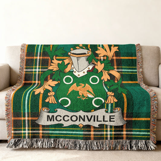 Green tartan blanket with McCoville crest and eagle.