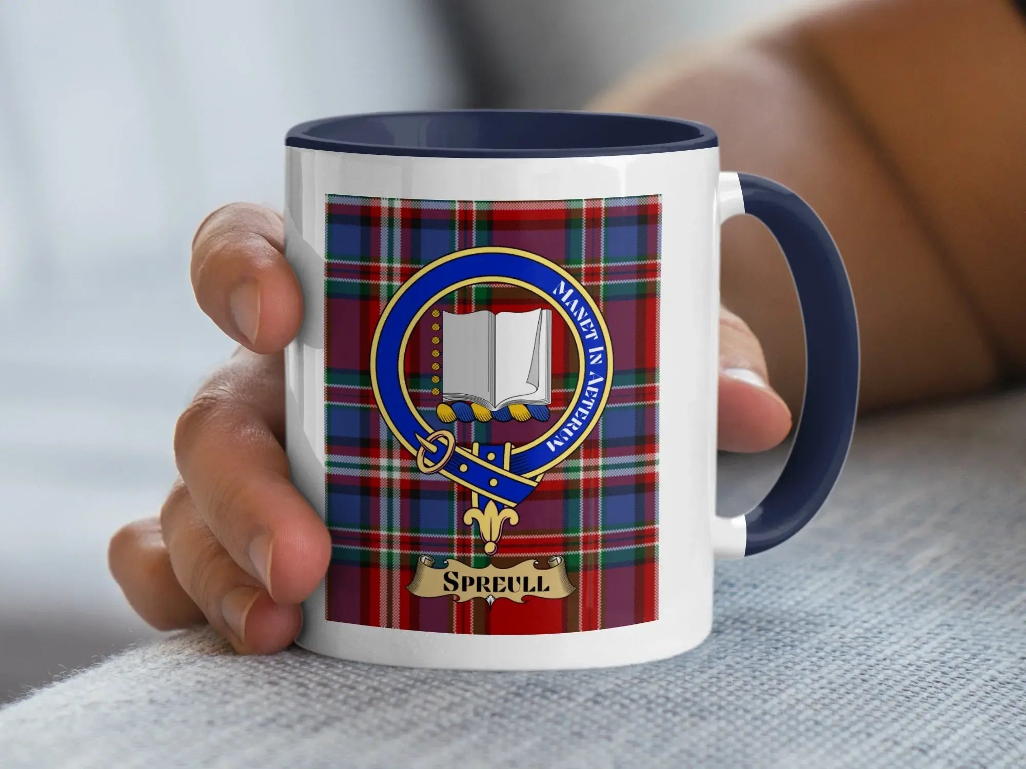 Spreull surname crest mug with the family crest on a tartan background, a Scottish heritage gift for a rare Glasgow and Renfrewshire name