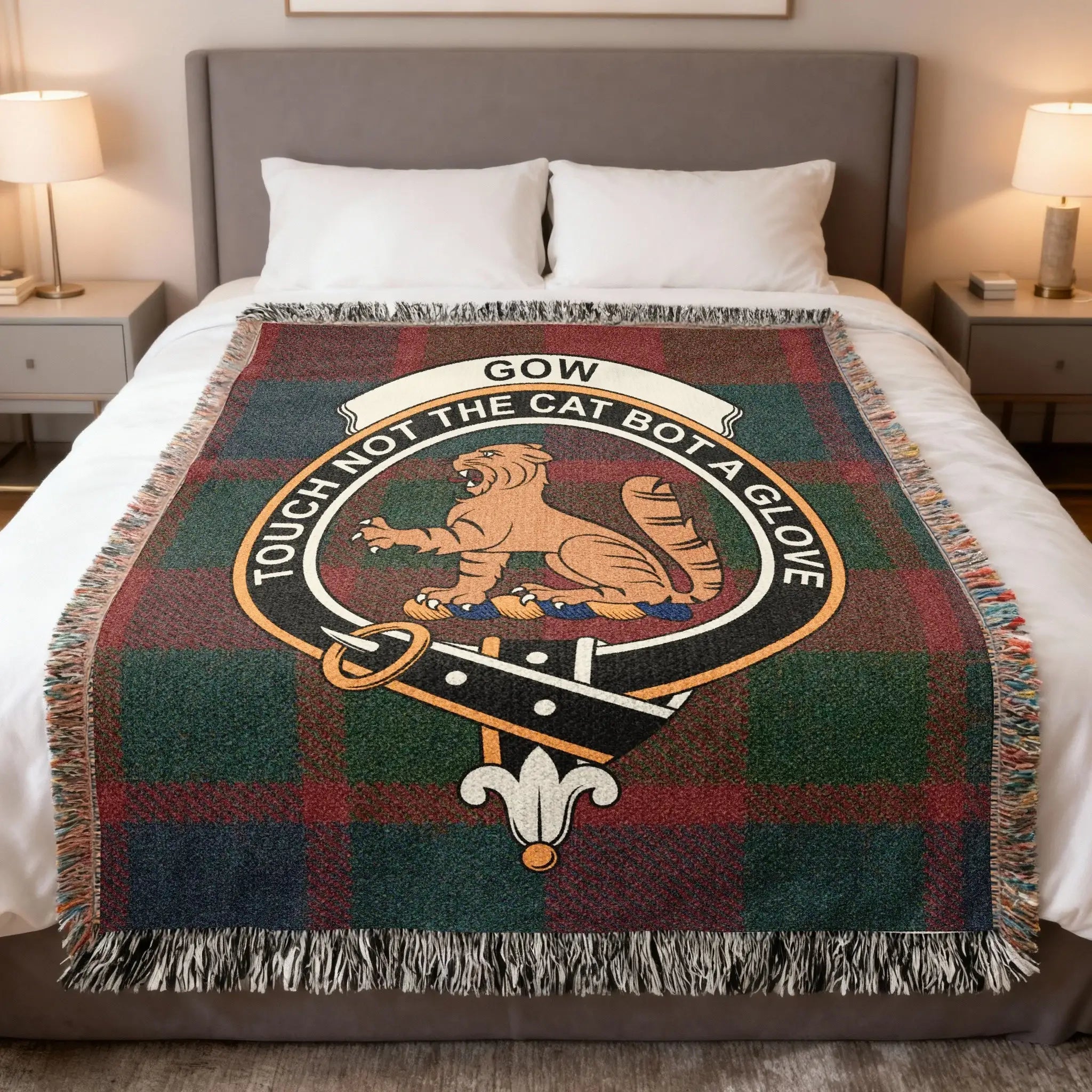 Gow clan Scottish tartan woven blanket representing Perthshire heritage and the motto Touch Not the Cat Bot a Glove
