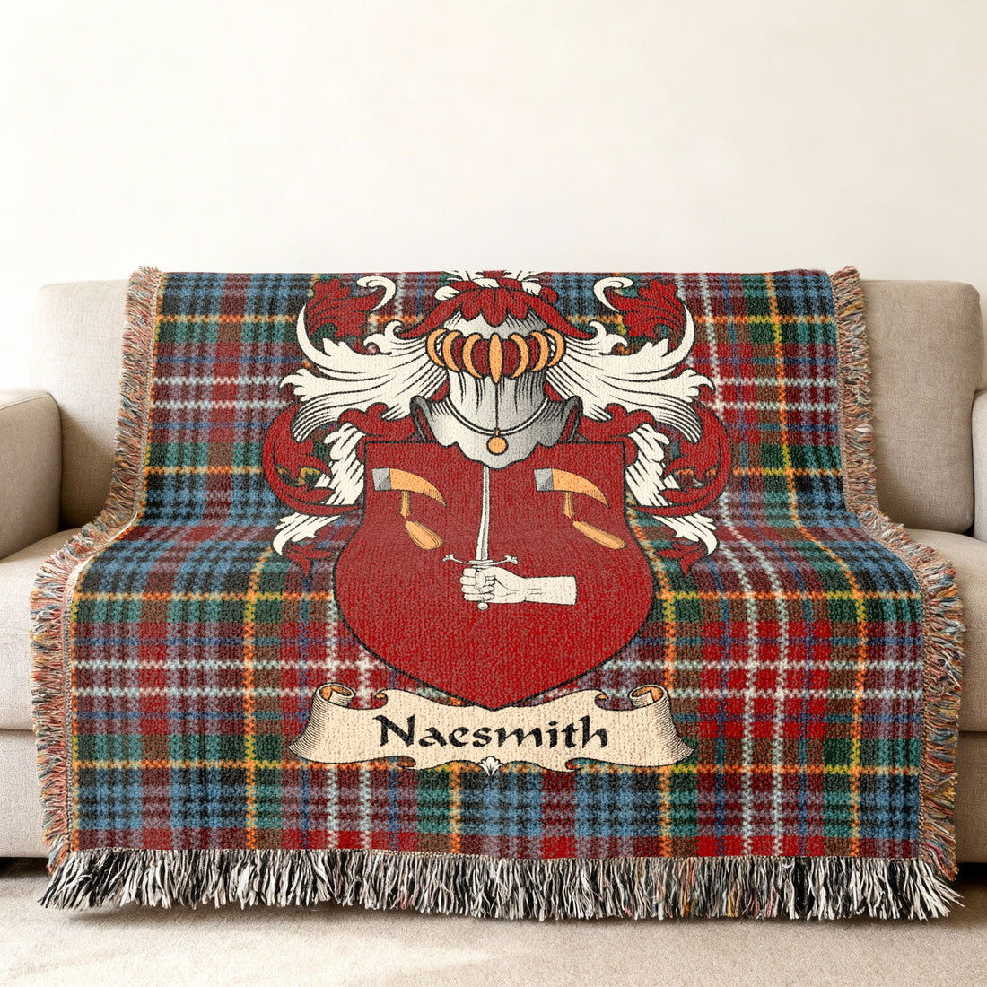 Naesmith Scottish family shield artwork on a woven blanket with Caledonia tartan-inspired background