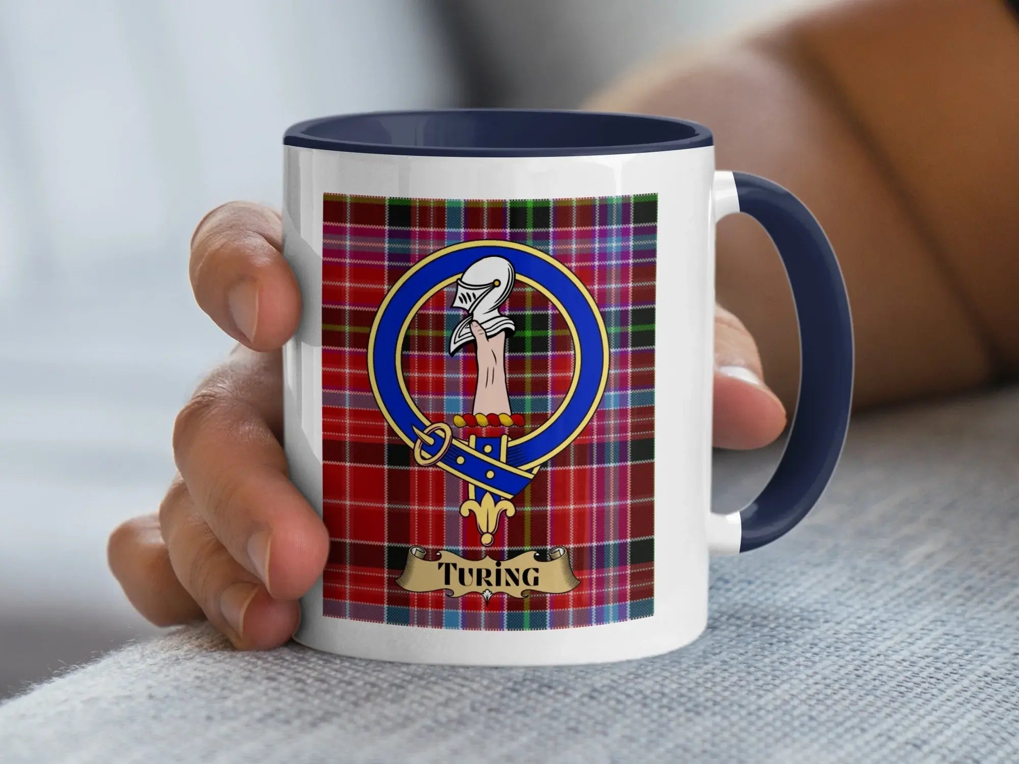 Turing family crest mug with the crest over a tartan background, a Scottish heritage gift for the Aberdeenshire surname held at Foveran