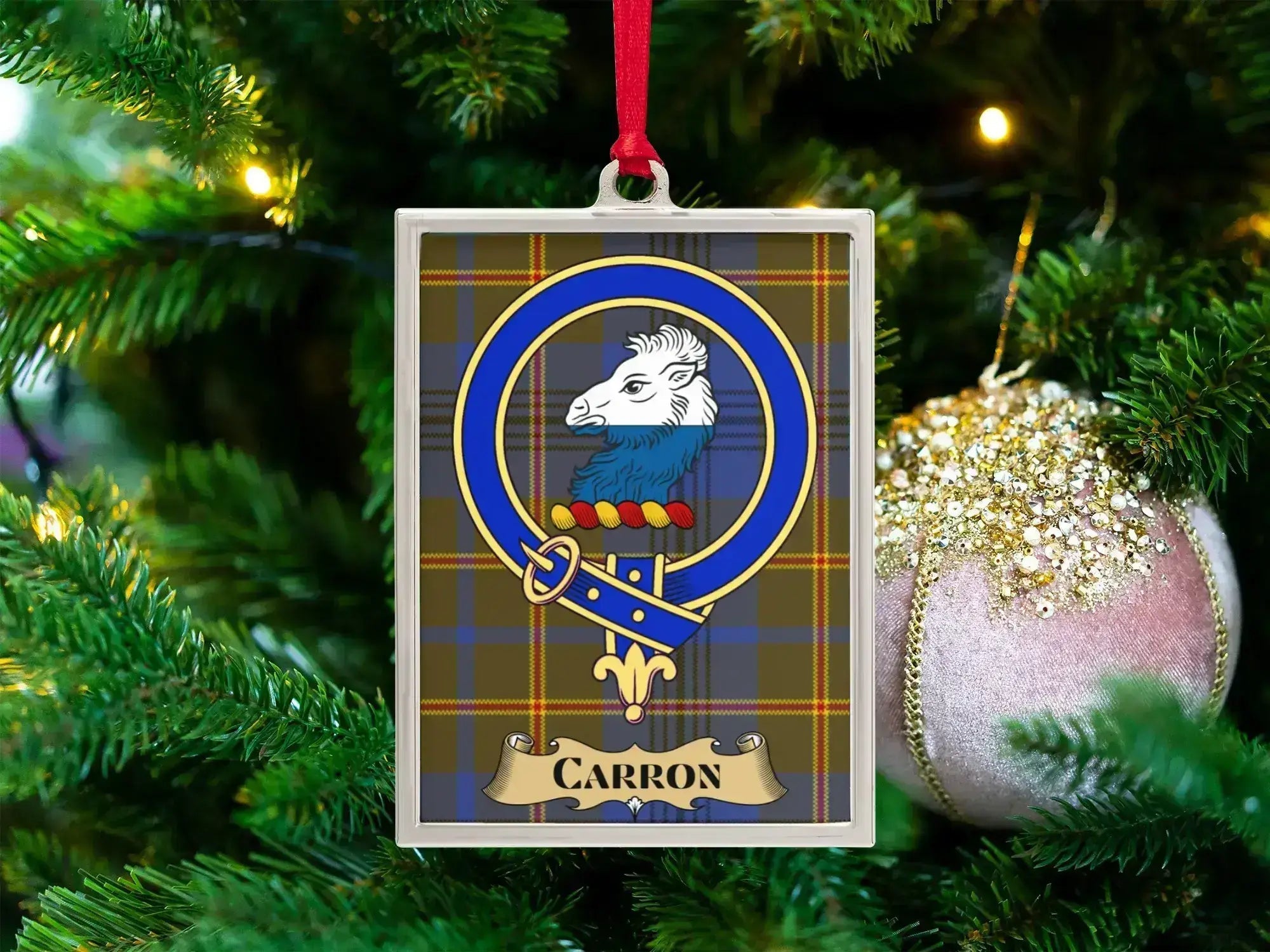 Carron Scottish family-name ornament with a crest design on a tartan background
