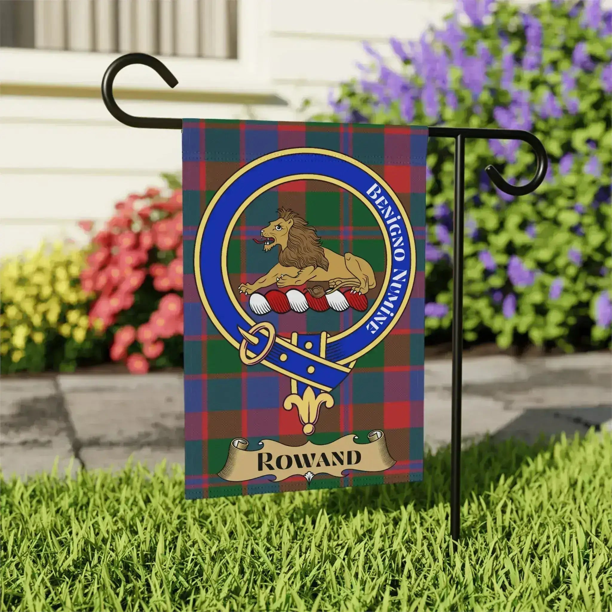 Rowand garden flag displaying a family crest above a tartan background, a Scottish heritage gift for a Renfrewshire surname