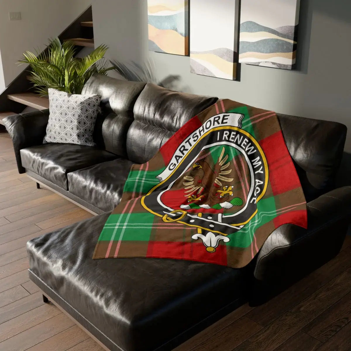 Gartshore family crest throw blanket on a tartan background, a Dunbartonshire heritage gift for the Gartshore surname