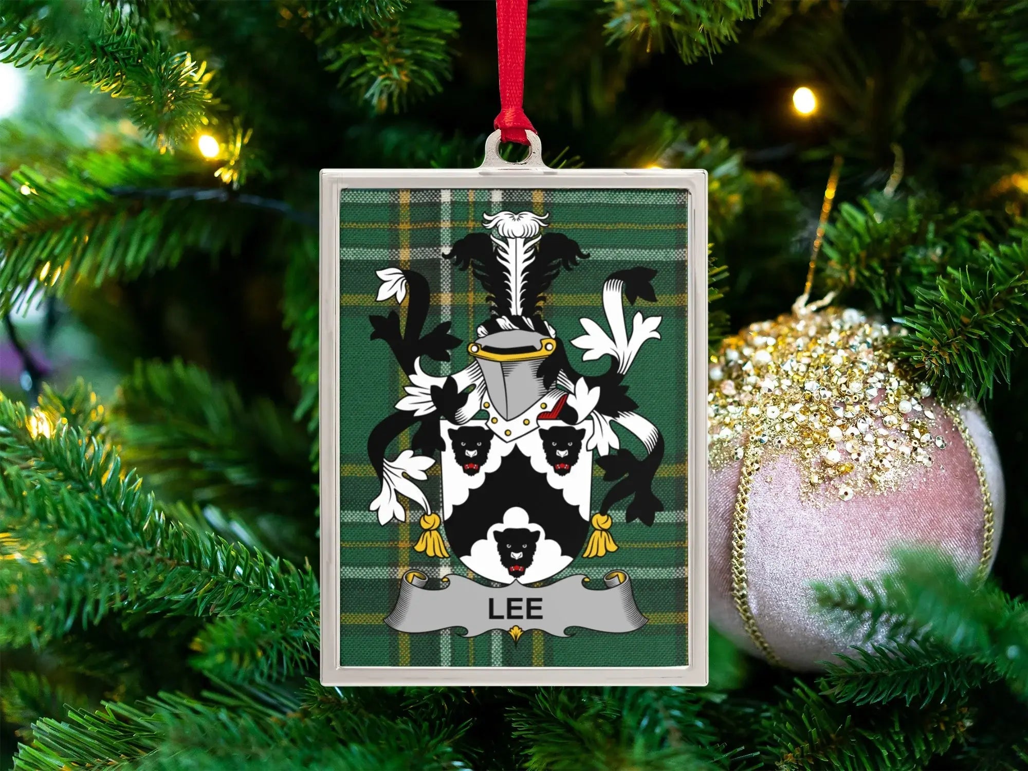 Lee family crest ornament on Irish tartan, celebrating Lee Gaelic and English heritage in Ireland