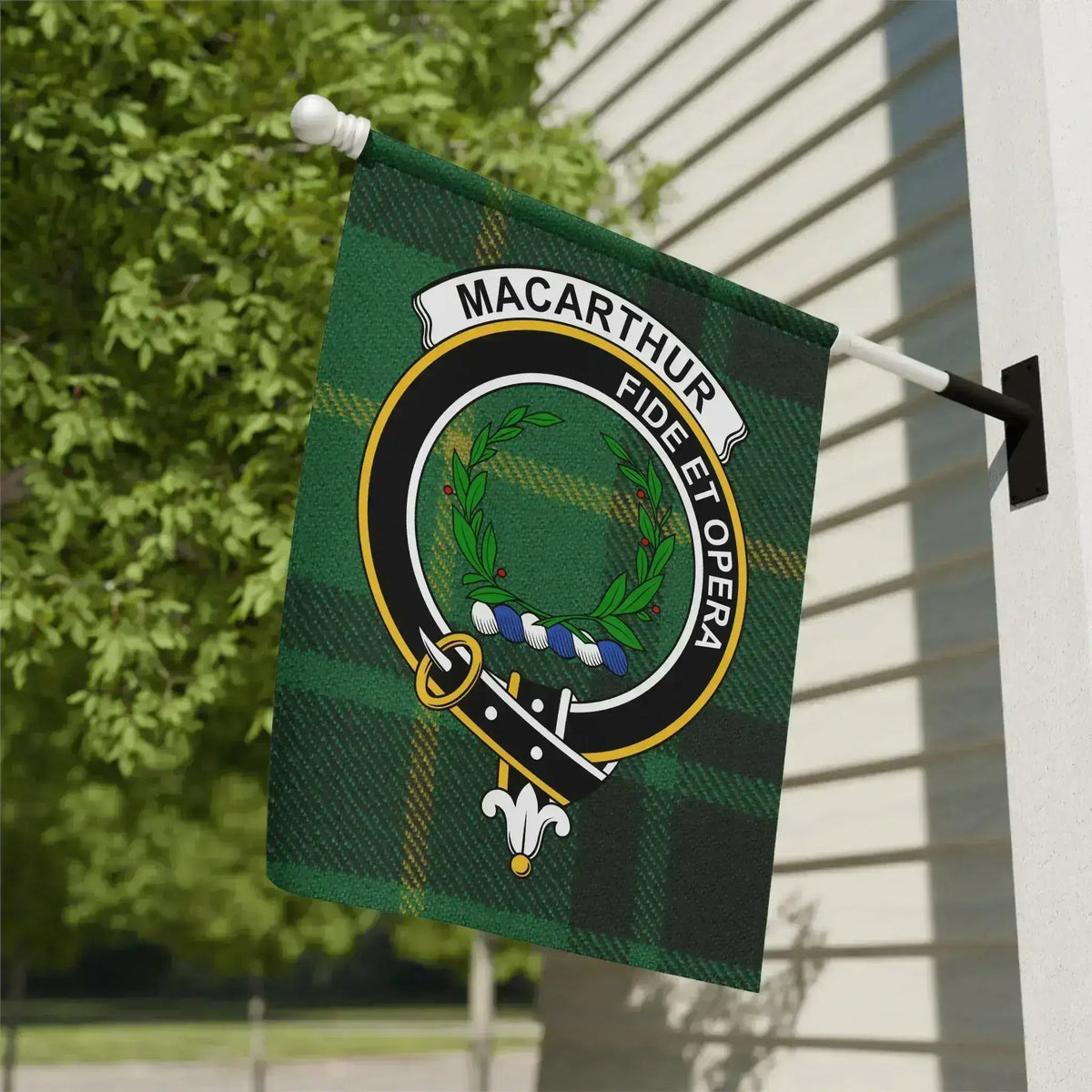 MacArthur clan crest and green tartan garden flag displayed outside a house