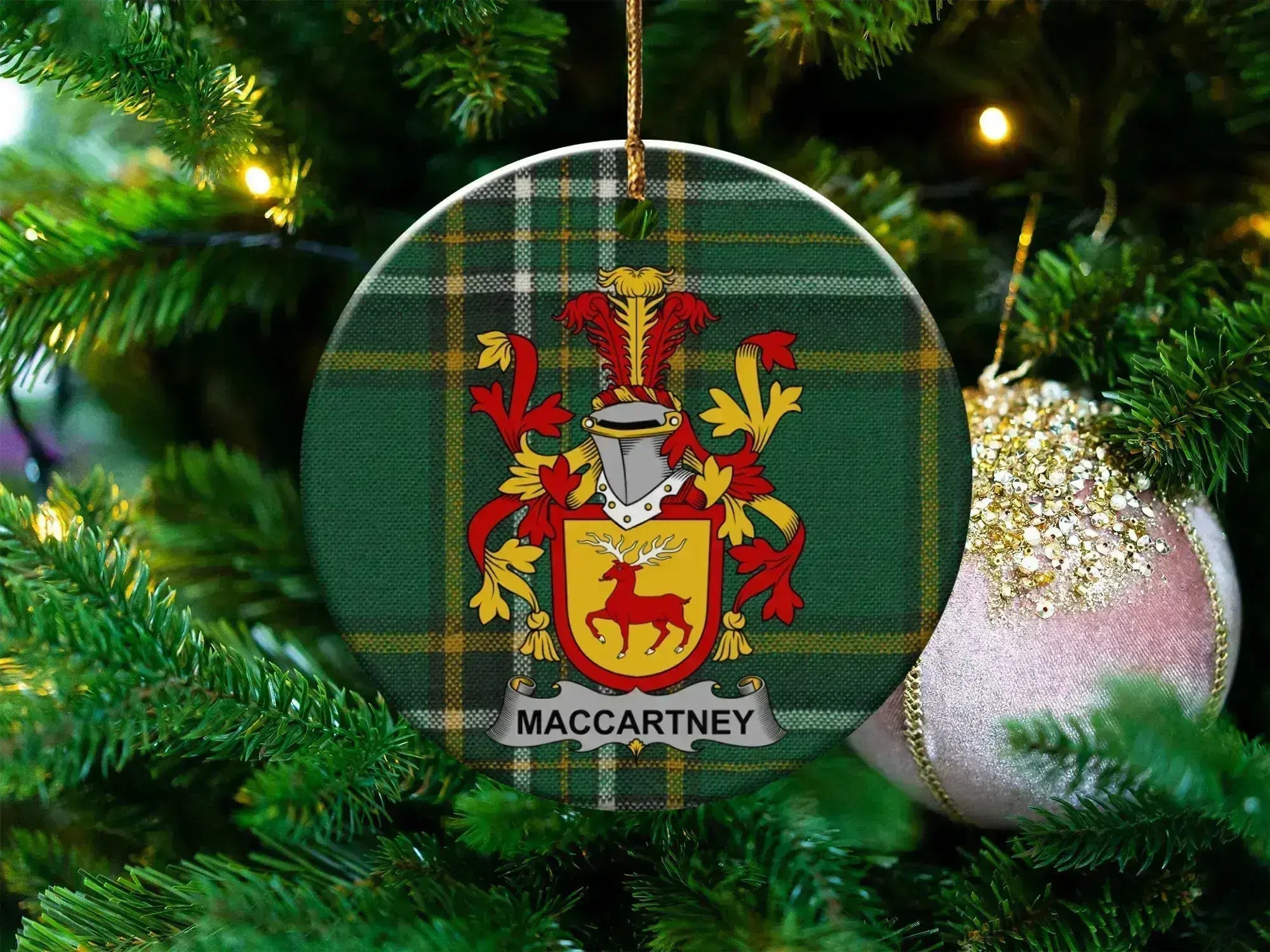McCartney family crest ornament on Irish tartan, celebrating McCartney Ulster heritage