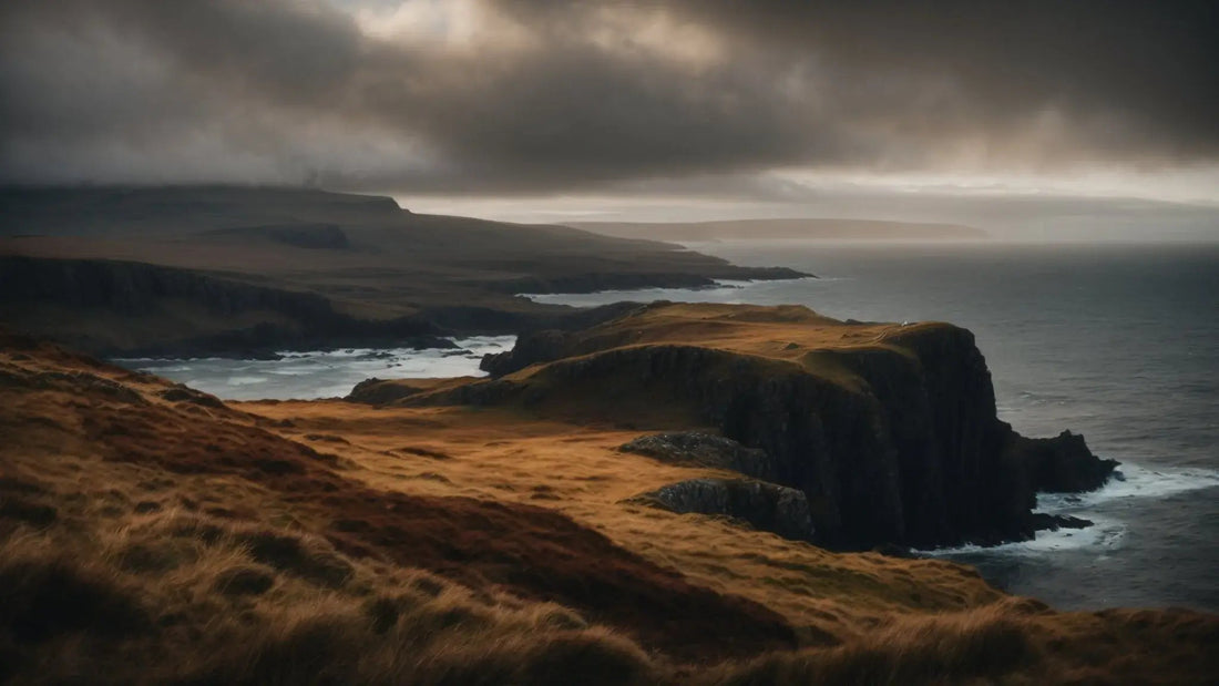 Windswept Scottish coastal cliffs under dark moody clouds and turbulent sea