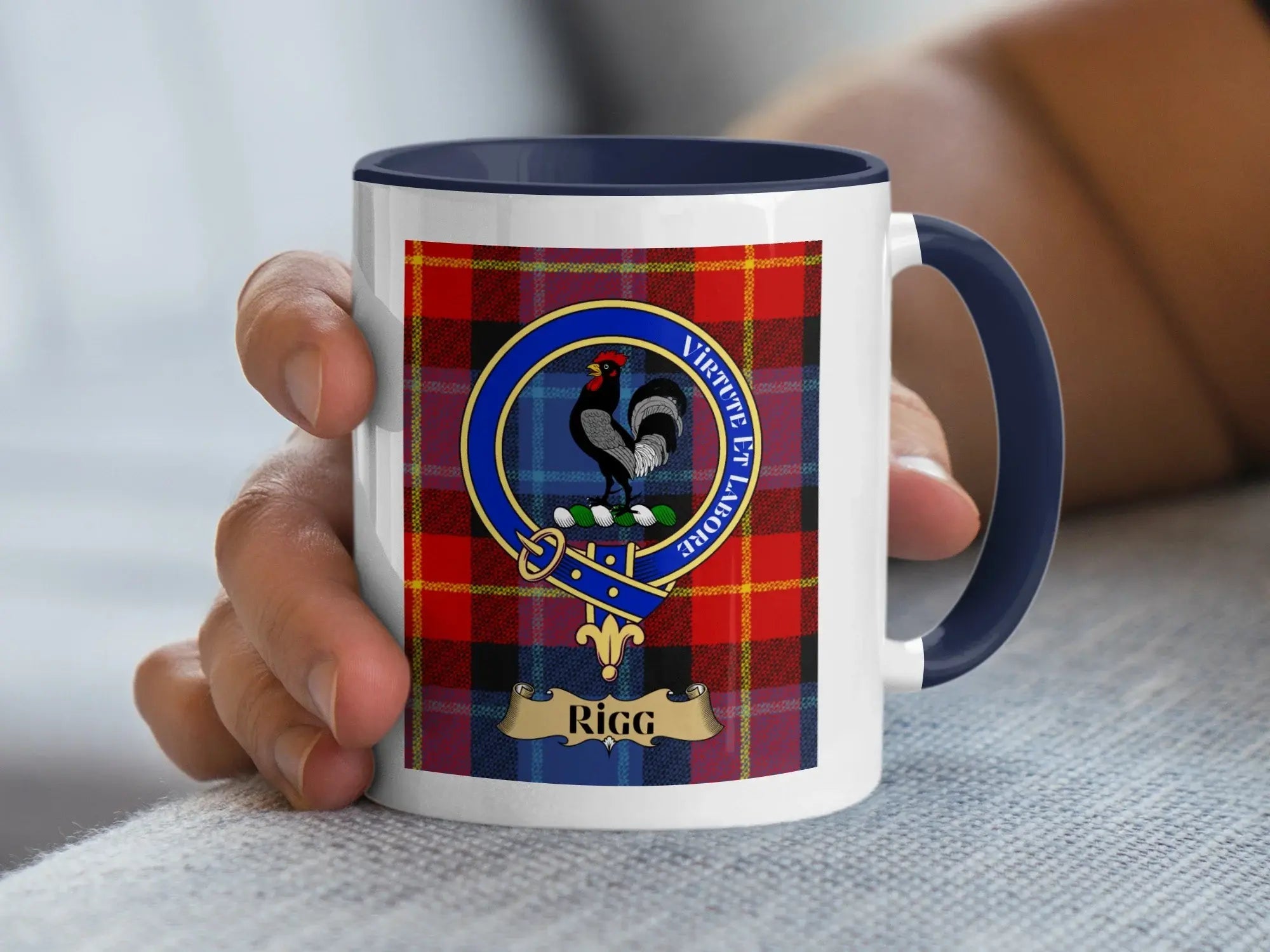 Rigg family crest mug on a tartan background, a Scottish heritage gift for the Border surname Rigg