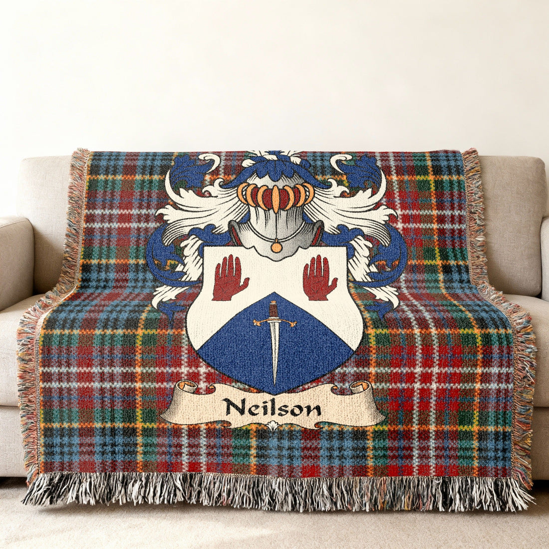 Neilson Scottish family shield artwork on a woven blanket with Caledonia tartan-inspired background