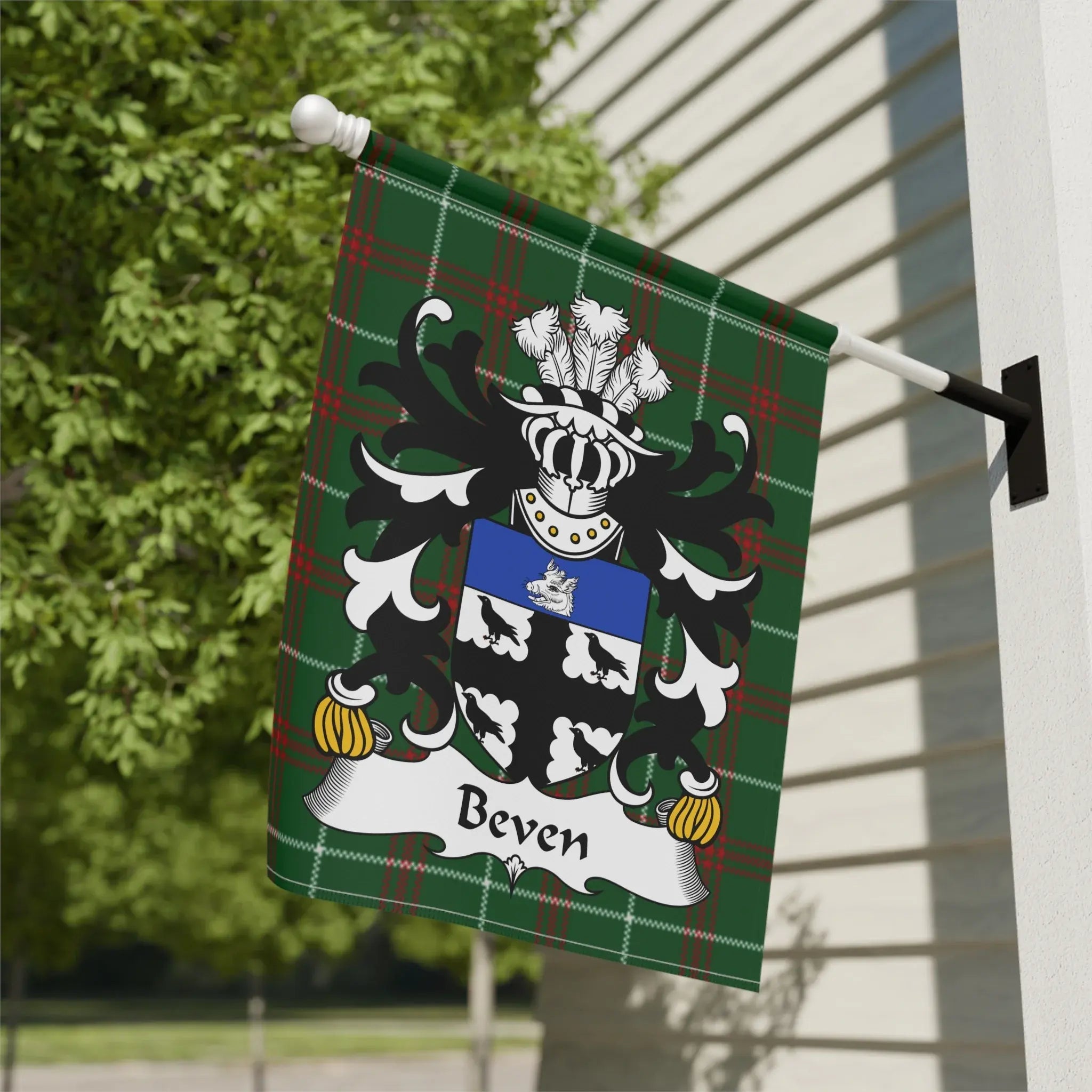 A Welsh family crest garden flag on Welsh National Tartan, the kind of Welsh pride on display at the National Eisteddfod each year
