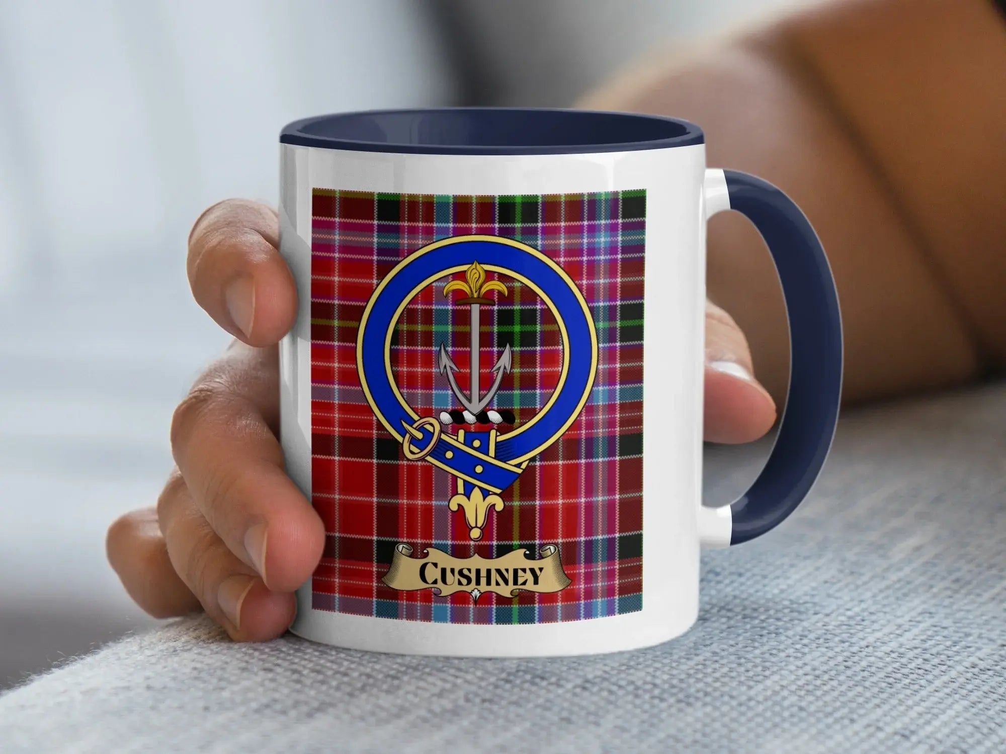 Cushney family crest mug on a tartan background, an Aberdeenshire heritage gift for the Cushney surname