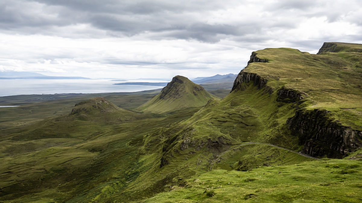 The Quiraing on the Isle of Skye, with green ridges and volcanic cliffs on the Trotternish peninsula.