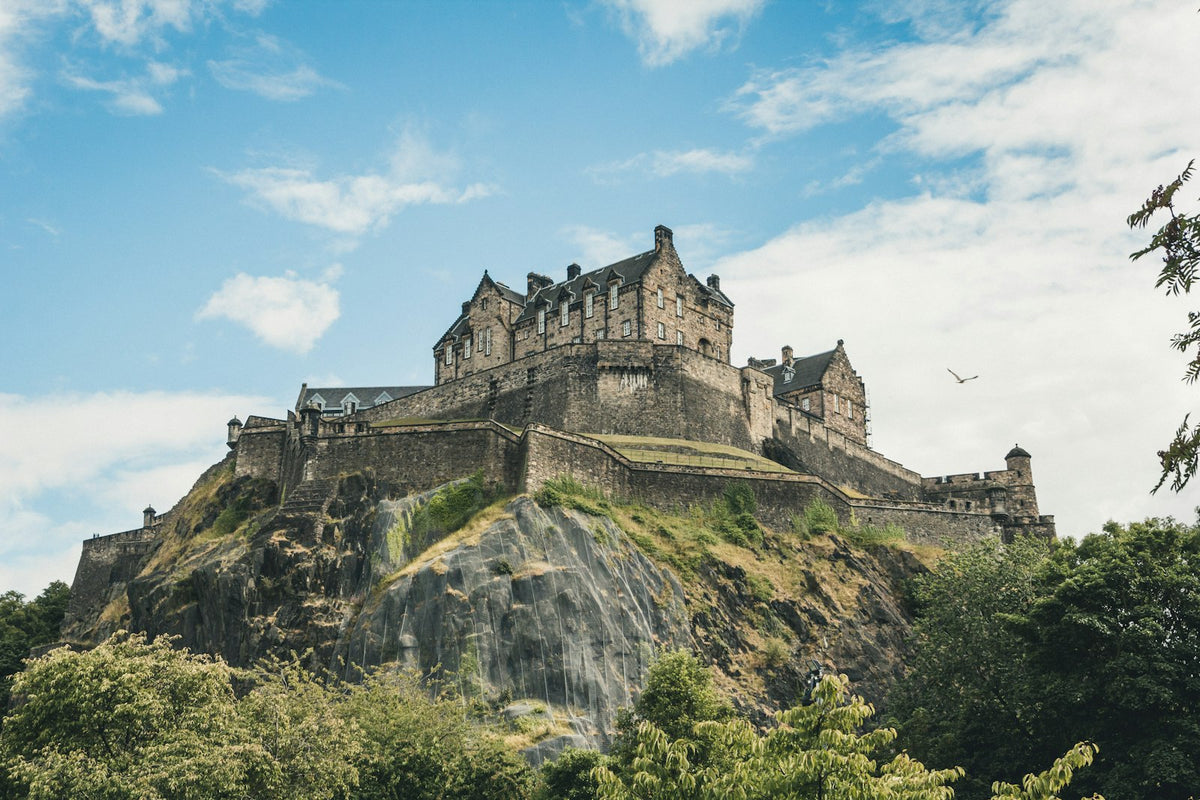 Edinburgh Castle on Castle Rock at dusk — Scotland's most visited castle attraction drawing over a million visitors annually
