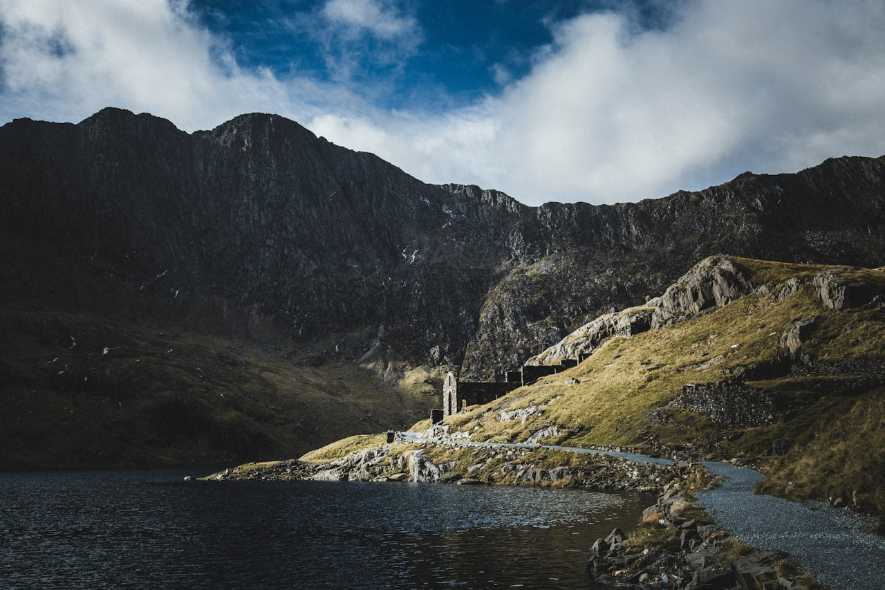 Dawn breaks over Snowdonia mountains and a remote Welsh valley – the ancient landscape that shaped the Welsh surnames celebrated in Celtic Ancestry Gifts heritage products