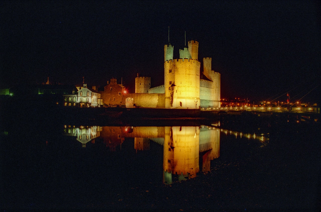 Caernarfon Castle illuminated at night Wales – the ancient heart of Welsh Celtic heritage and one of the great symbols of the Celtic world
