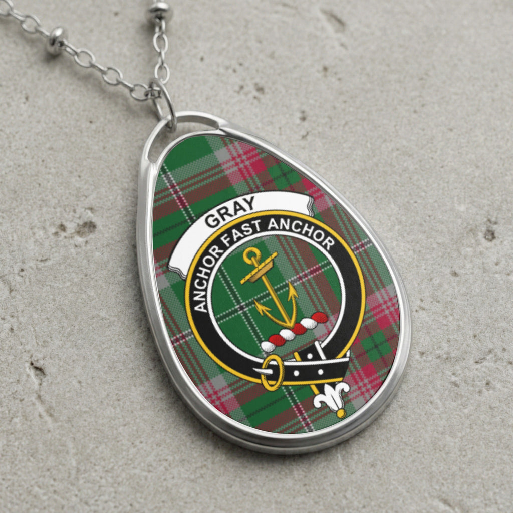 Gray clan Scottish tartan necklace with clan crest on tartan background