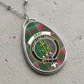 Gray clan Scottish tartan necklace with clan crest on tartan background