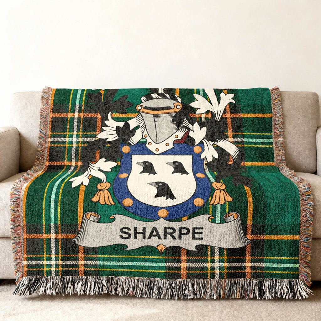 Green tartan plaid throw blanket with a Sharpe family crest.