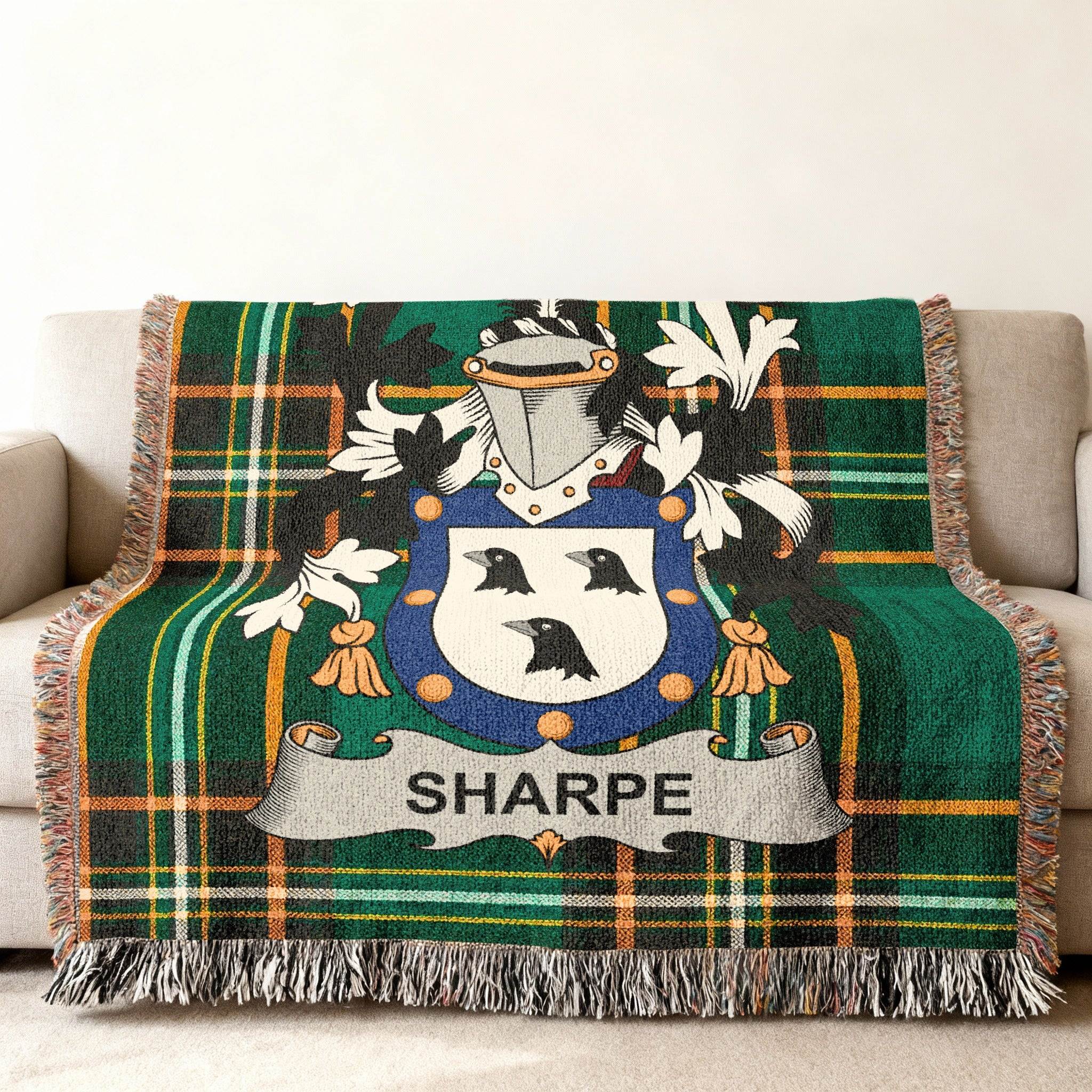 Green tartan plaid throw blanket with a Sharpe family crest.