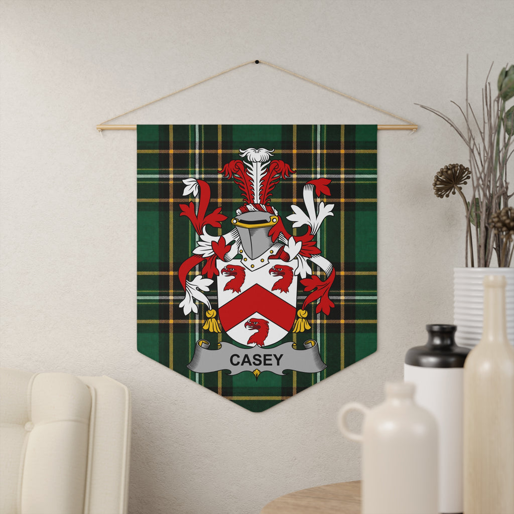 Casey family crest on a green tartan pennant hanging on a wall.