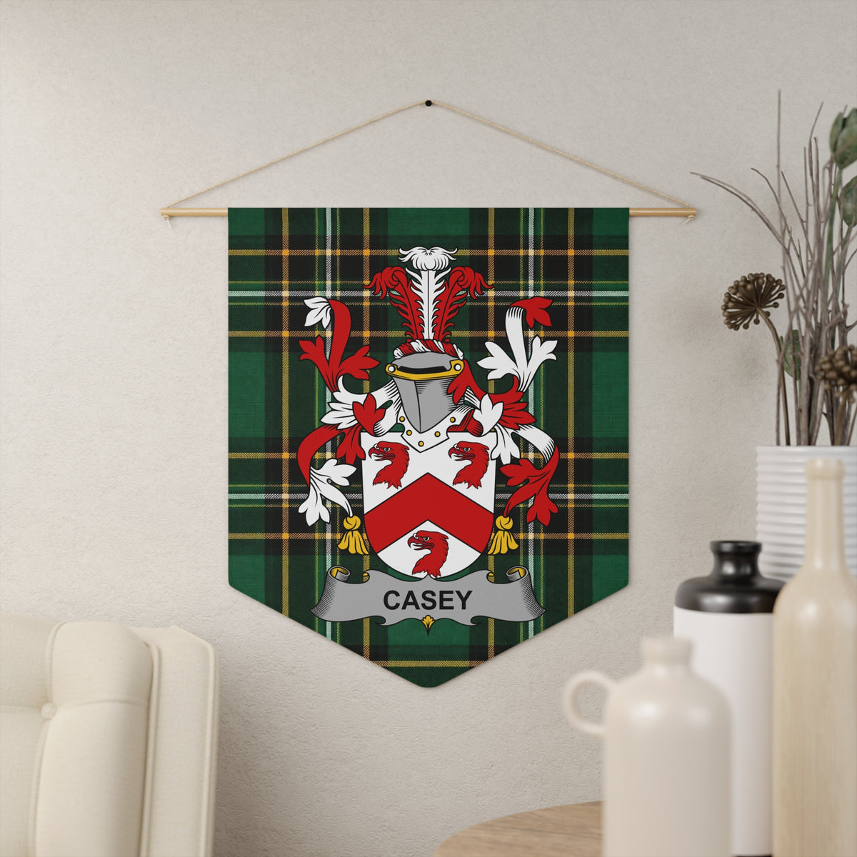 Casey family crest on a green tartan pennant hanging on a wall.