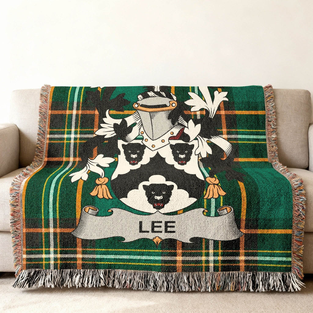 Lee family crest woven into a green tartan plaid throw blanket.