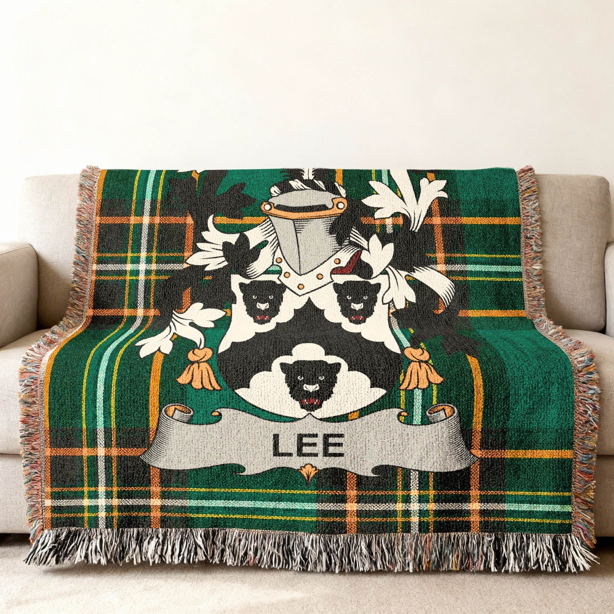 Lee family crest woven into a green tartan plaid throw blanket.