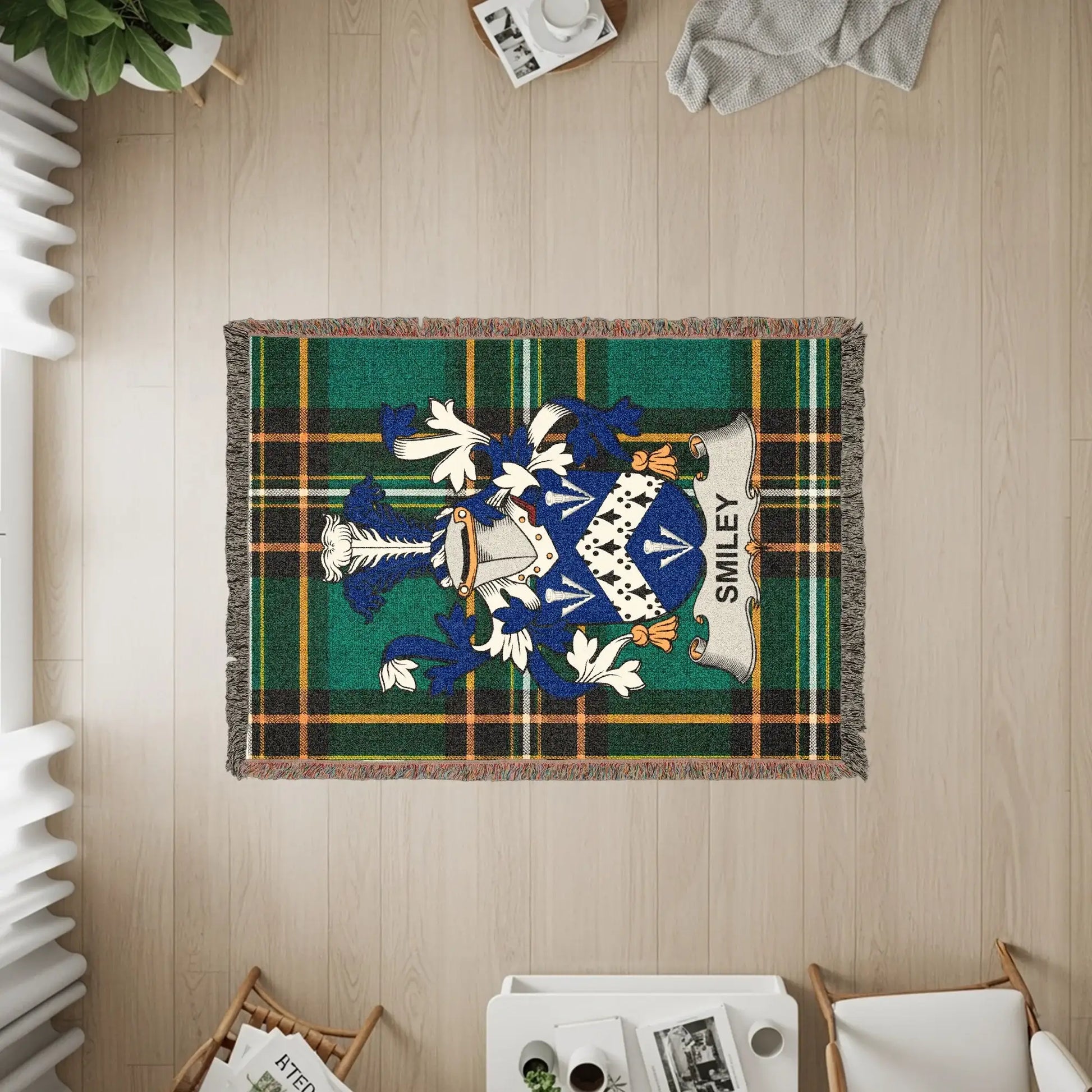 Green and blue tartan blanket with a blue and white family crest featuring the name "SMILEY".
