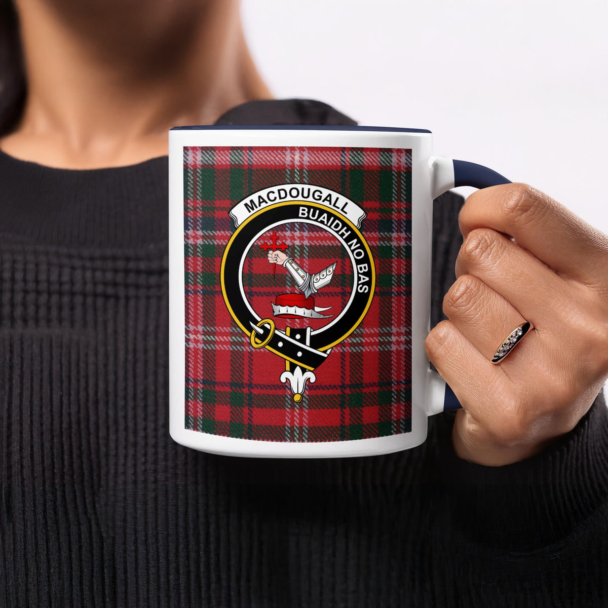 Close-up lifestyle view of MacDougall Scottish clan crest artwork on a navy 11 oz accent mug with a tartan background