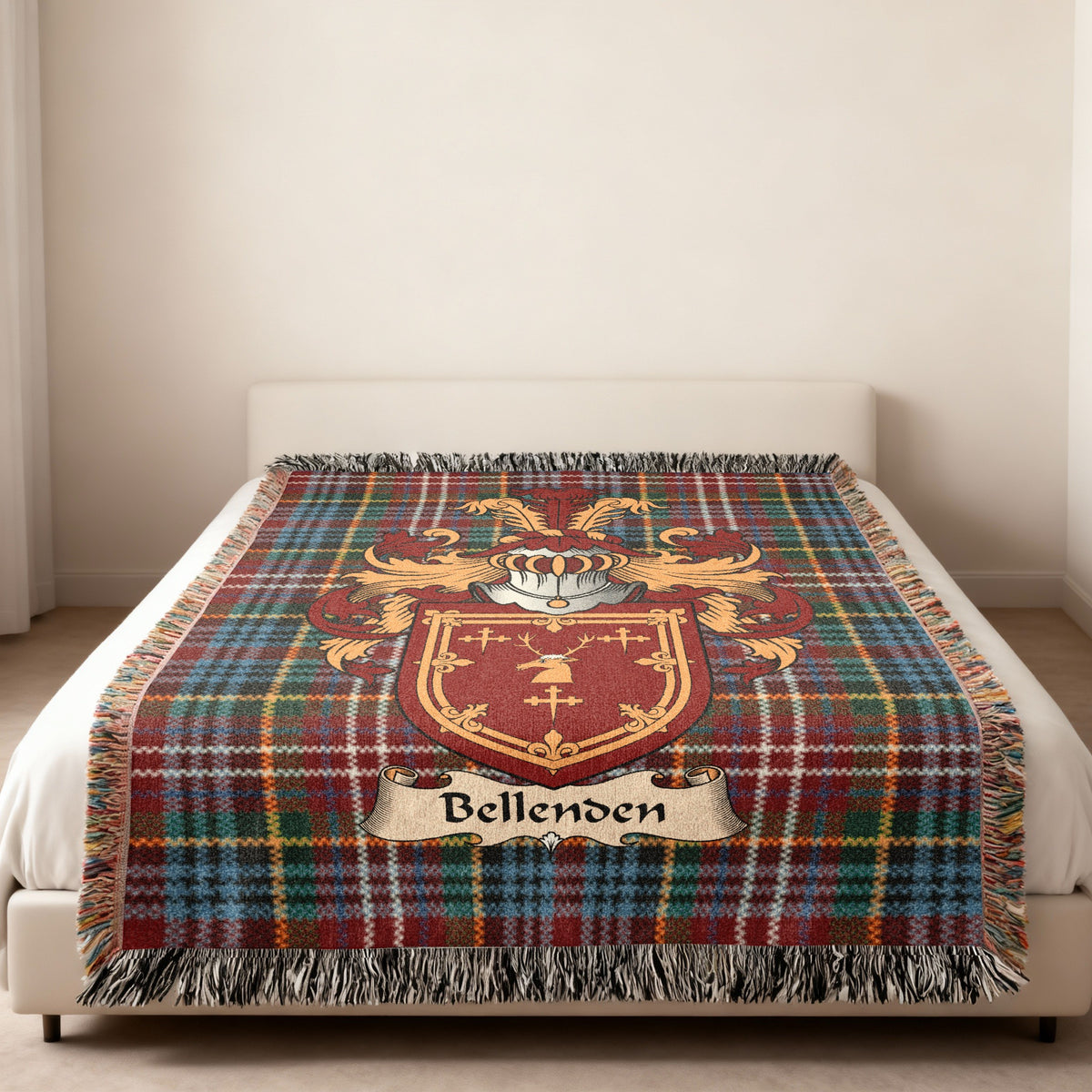 Bellenden family crest emblem on a Caledonia tartan woven blanket