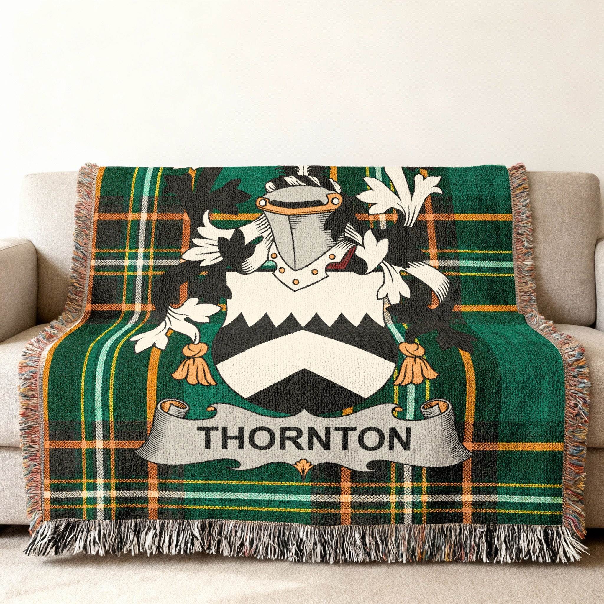Green tartan blanket with Thornton family crest displayed.