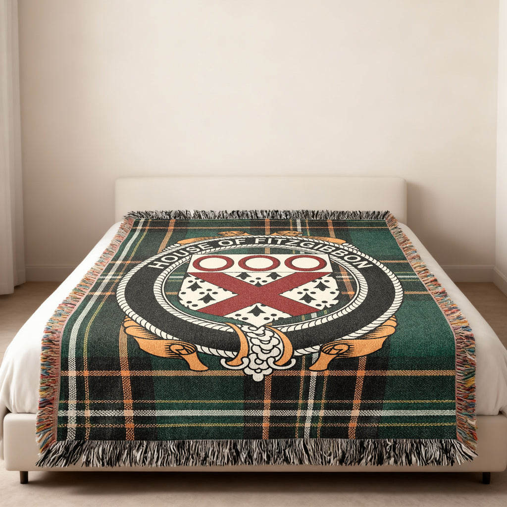 Fitzgibbon family crest emblem woven blanket displayed on a bed