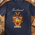 Navy MacDonnell family shield T-shirt featuring a red spread-winged bird on a gold shield