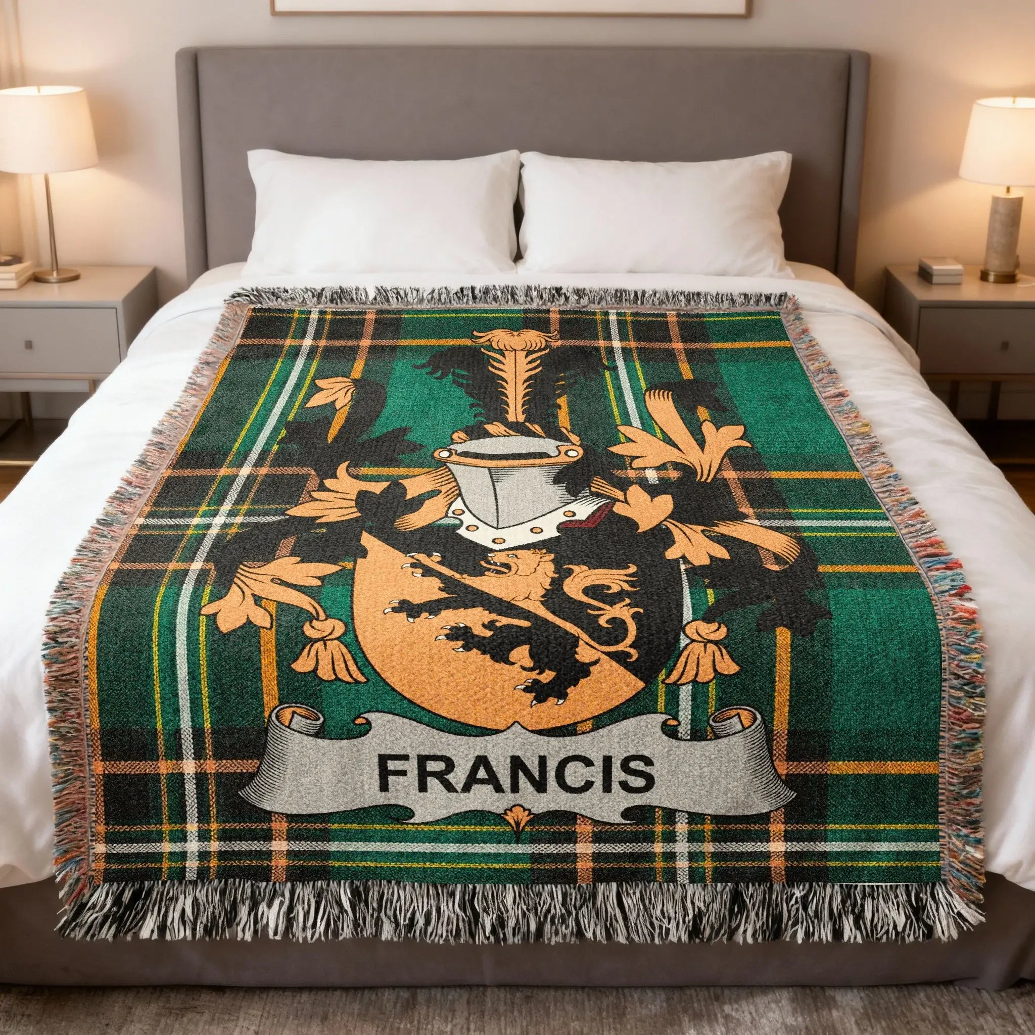 Green plaid blanket with the FRANCIS family crest on a bed.