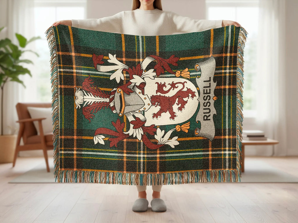 Russell tartan blanket with a lion crest and tasseled edges.