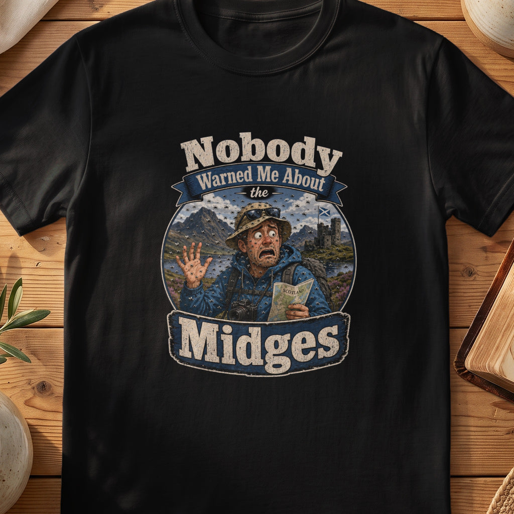 Black Gildan 64000 unisex T-shirt flatlay with Nobody Warned Me About the Midges Scottish graphic design