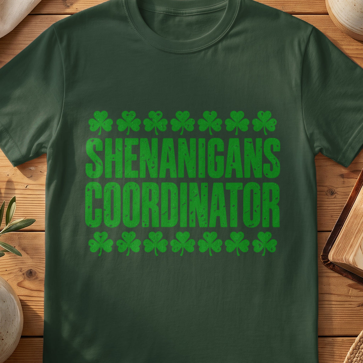 Green T-shirt with shamrocks and “Shenanigans Coordinator” retro graphic.