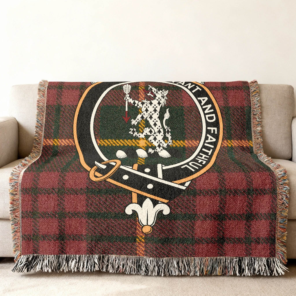 MacQueen tartan woven blanket displayed on wall — clan crest and plaid as framed heritage piece