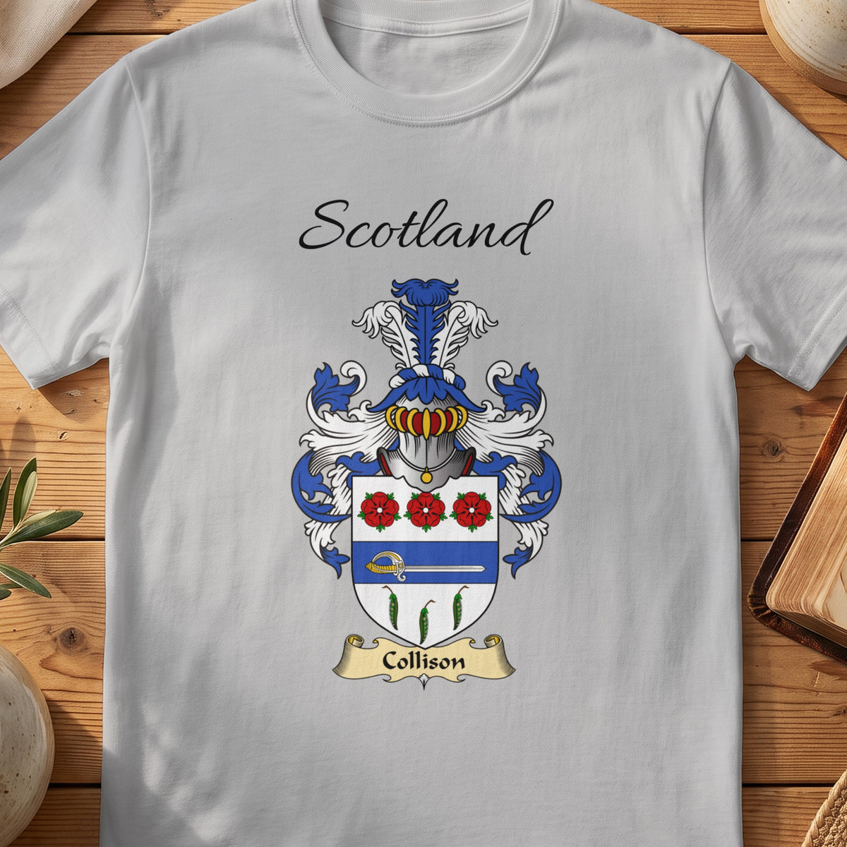 Sport Grey Collison Scottish family shield T-shirt featuring red flowers above a blue band and green leaf motifs