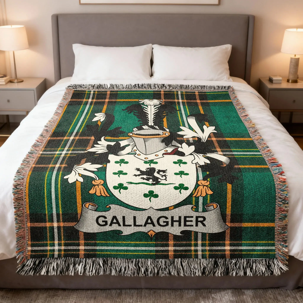 Gallagher tartan blanket with coat of arms displayed on a bed.