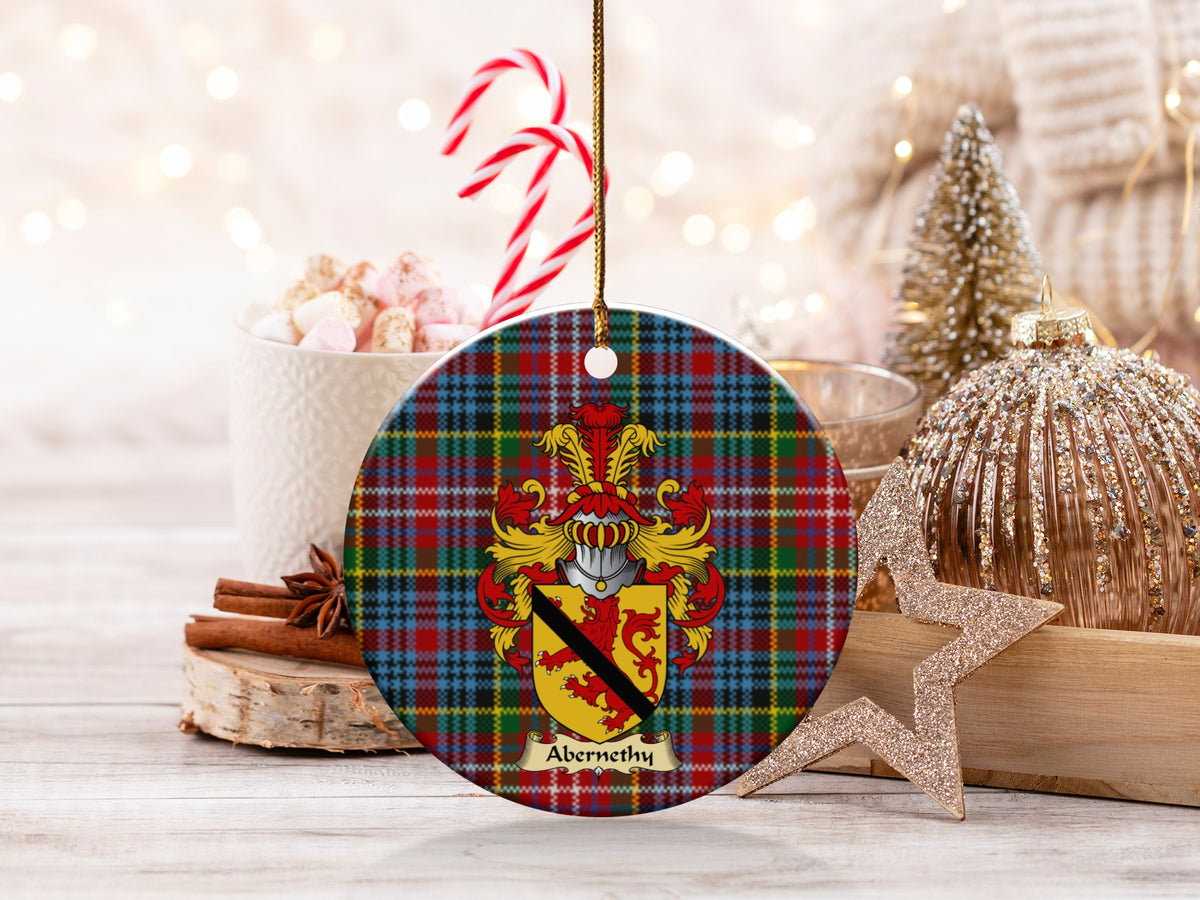 Abernethy family emblem ceramic Christmas ornament with Caledonia tartan background in festive holiday décor