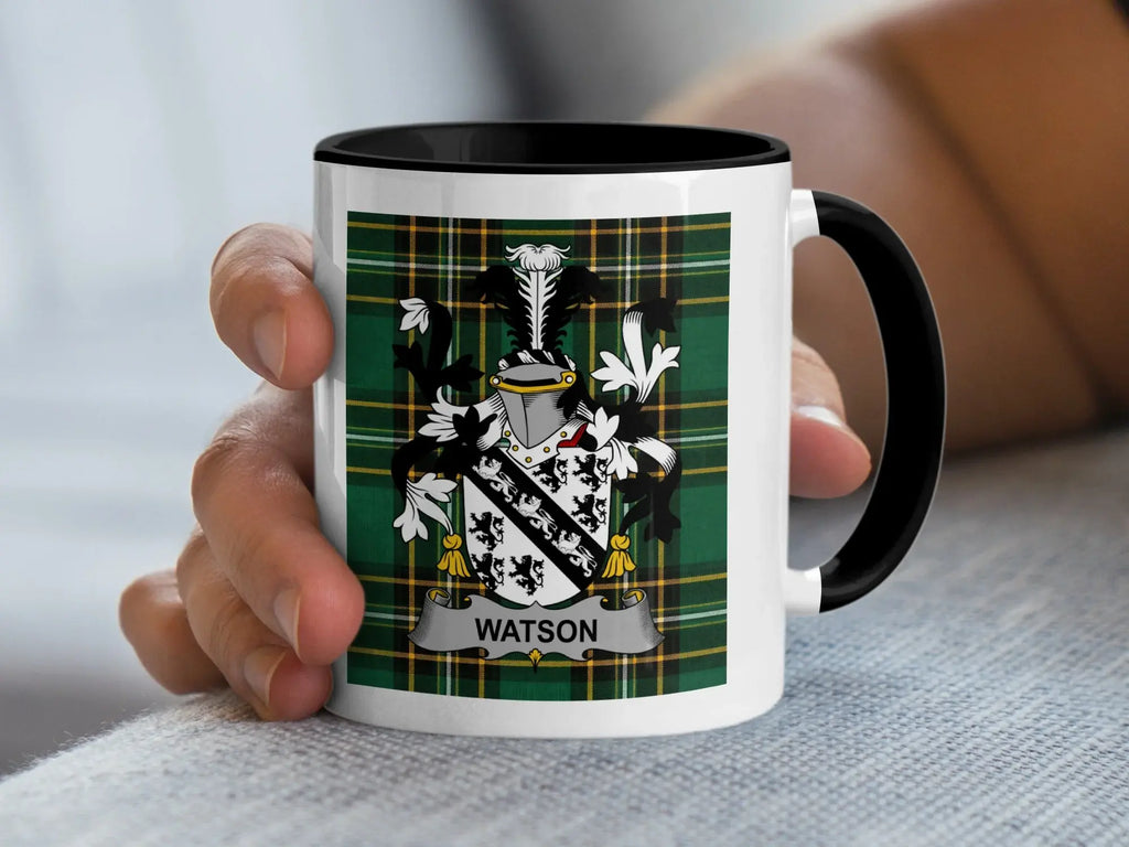 White mug with a black rim, featuring a green tartan pattern and a Watson family crest.