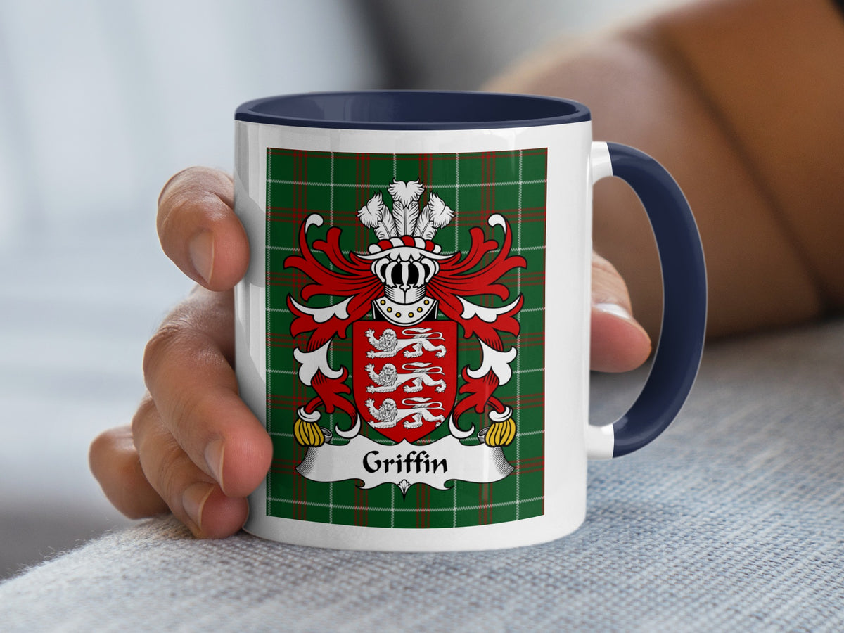 Mug with Griffin family crest on green tartan background and navy blue handle.