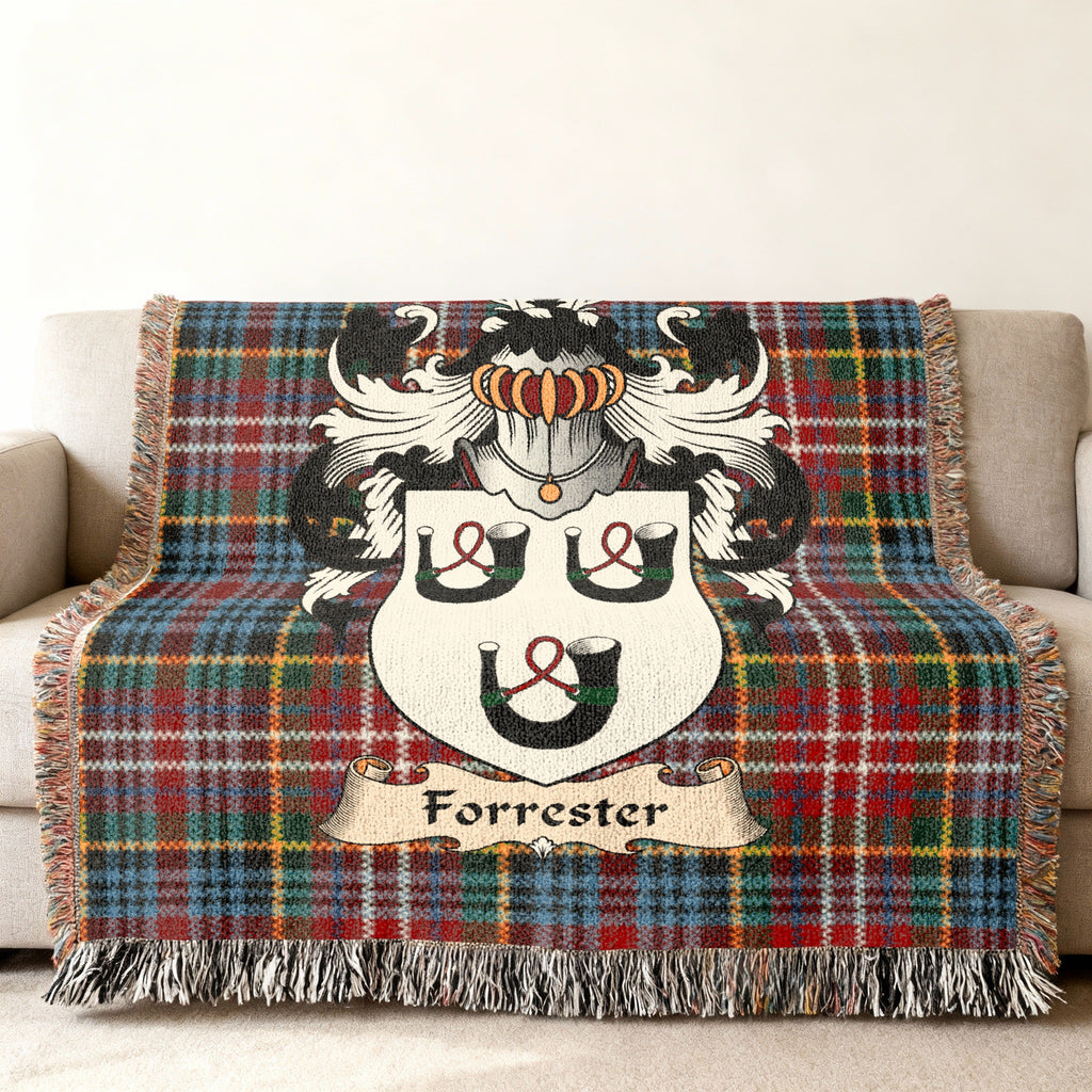 Forrester family crest emblem on a Caledonia tartan woven blanket