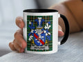 White mug with black handle displaying a blue and gold family crest with "Heyland" banner.